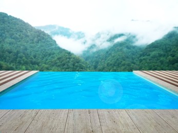 Image of Outdoor swimming pool at luxury resort with beautiful view of mountains