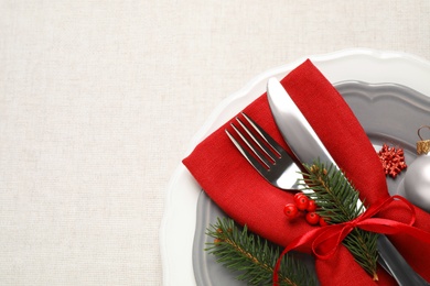 Festive table setting with beautiful dishware and Christmas decor on white background, top view. Space for text