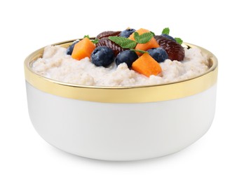 Delicious barley porridge with blueberries, pumpkin, dates and mint in bowl isolated on white