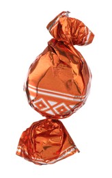 Candy in orange wrapper isolated on white