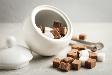 Photo of Bowl and refined sugar cubes on light table