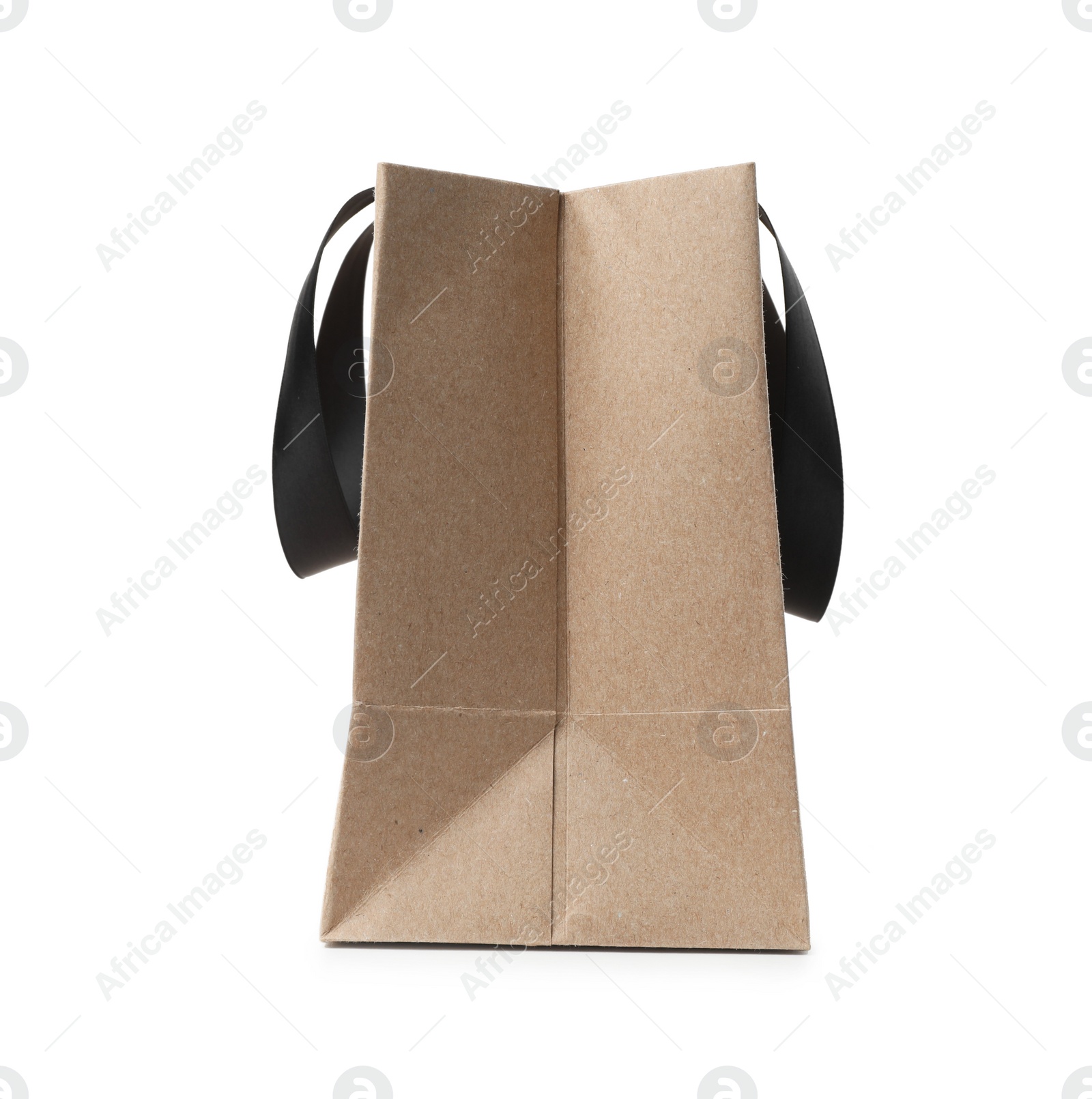 Photo of Paper shopping bag with ribbon handles on white background