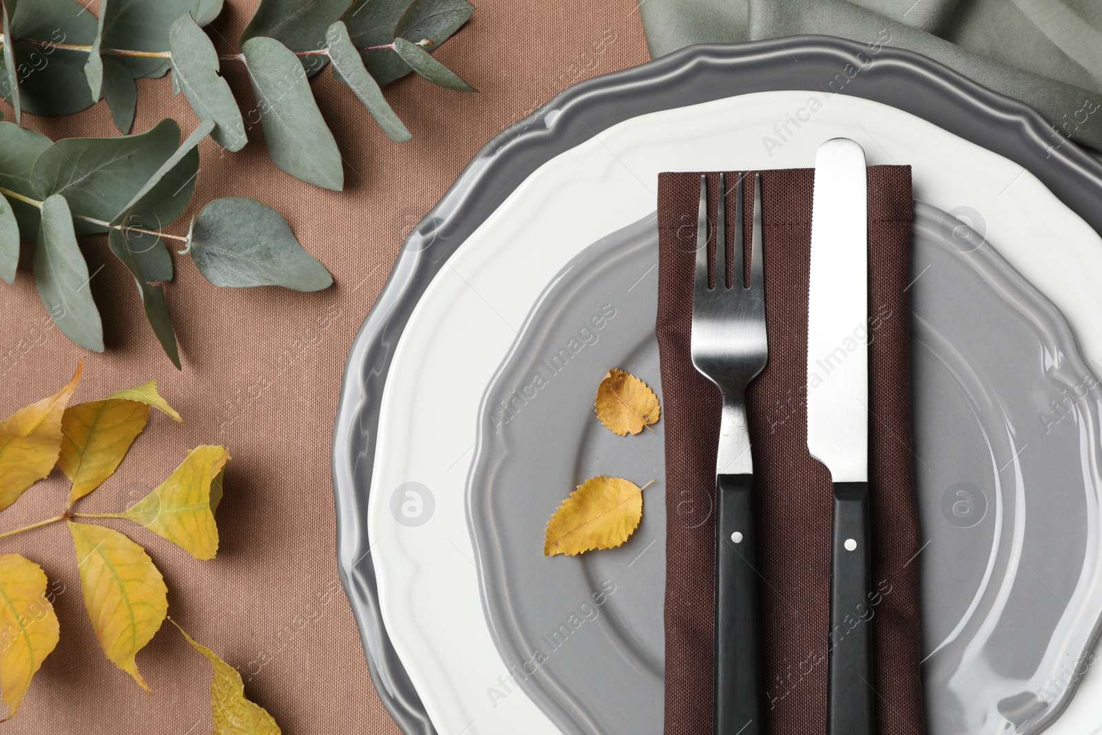 Photo of Beautiful autumn place setting and decor for festive dinner on table, flat lay