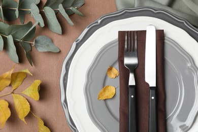 Photo of Beautiful autumn place setting and decor for festive dinner on table, flat lay