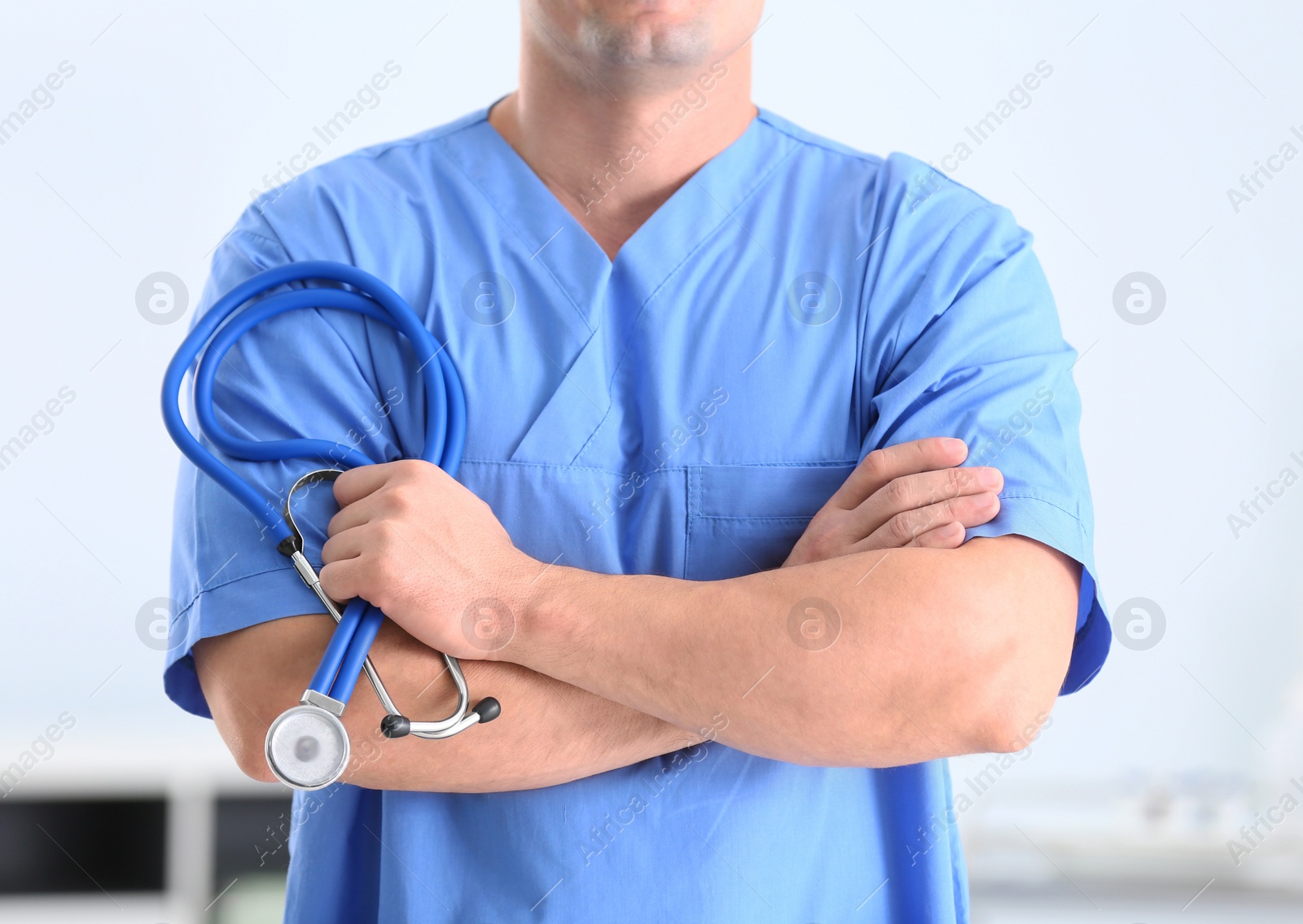 Photo of Medical assistant with stethoscope in hospital, closeup