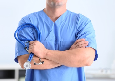 Medical assistant with stethoscope in hospital, closeup