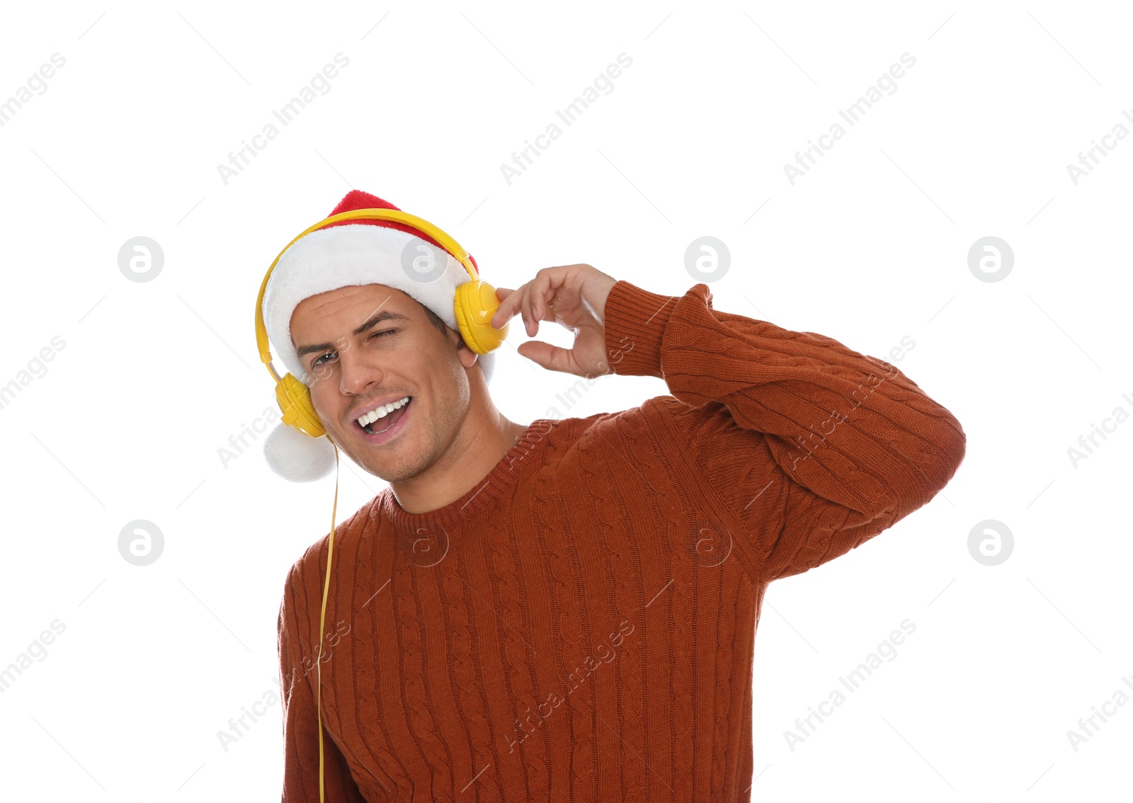 Photo of Emotional man with headphones on white background. Christmas music