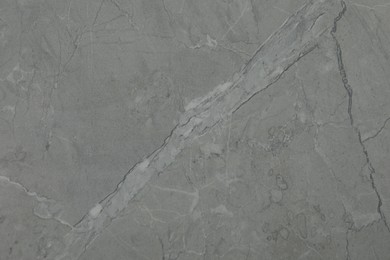 Texture of light grey marble surface as background, closeup