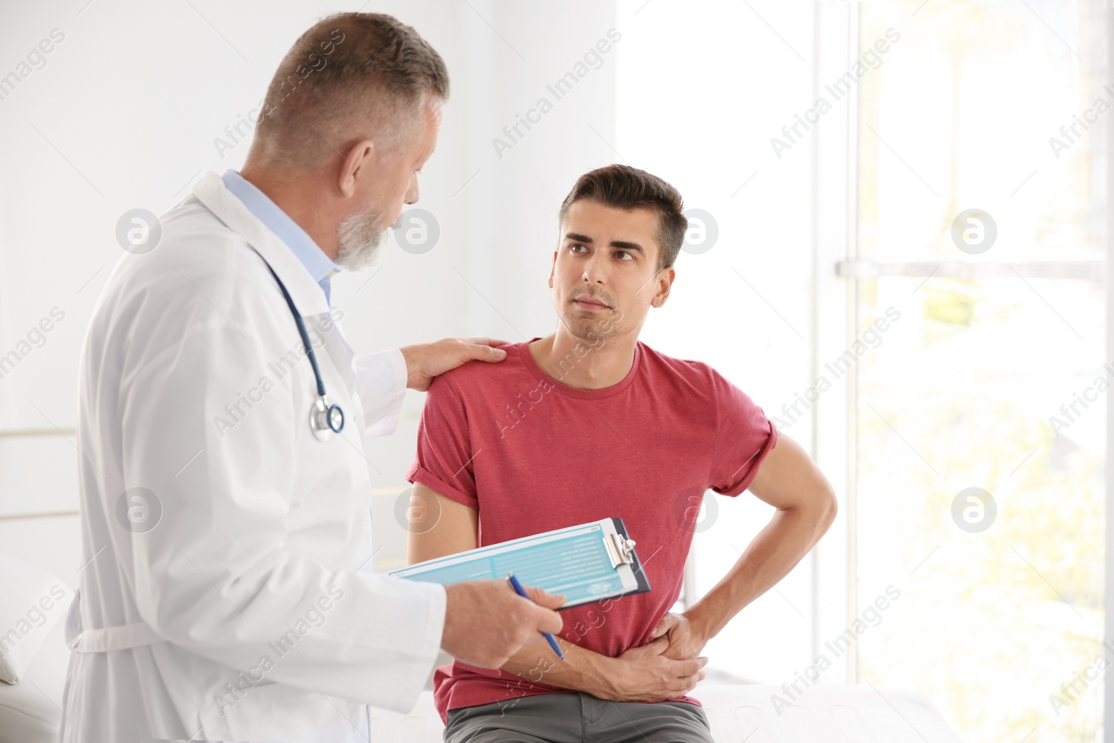 Photo of Man with health problem visiting urologist at hospital