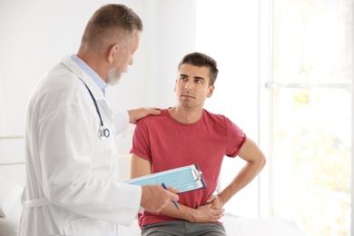 Photo of Man with health problem visiting urologist at hospital