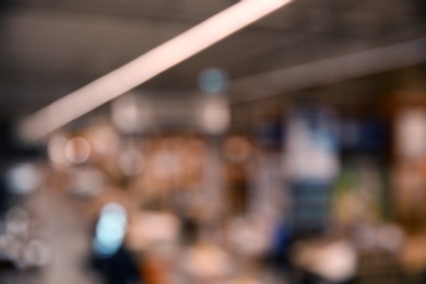 Photo of Blurred view of modern shopping mall interior