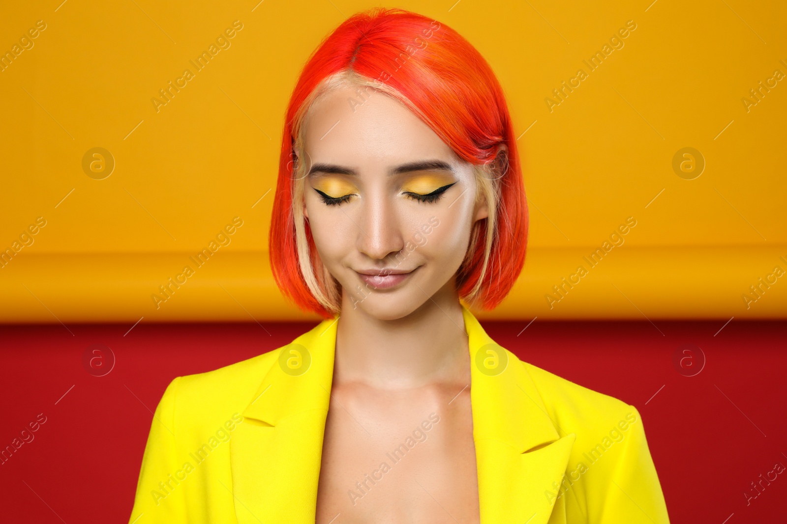 Photo of Beautiful young woman with bright dyed hair on color background