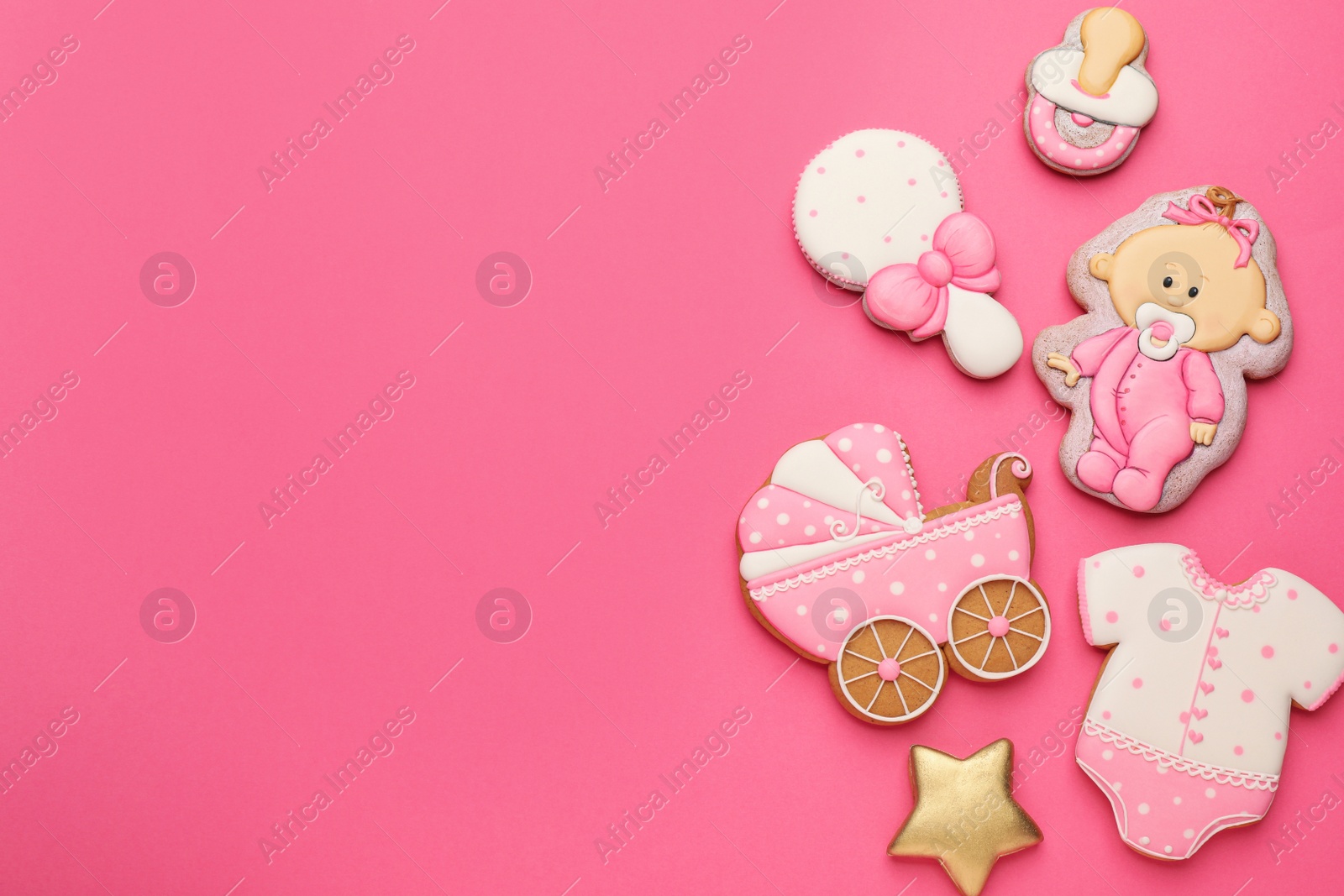 Photo of Cute tasty cookies of different shapes on pink background, flat lay with space for text. Baby shower party
