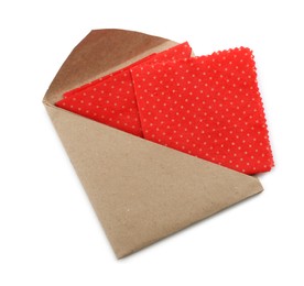 Red reusable beeswax food wraps on white background, top view