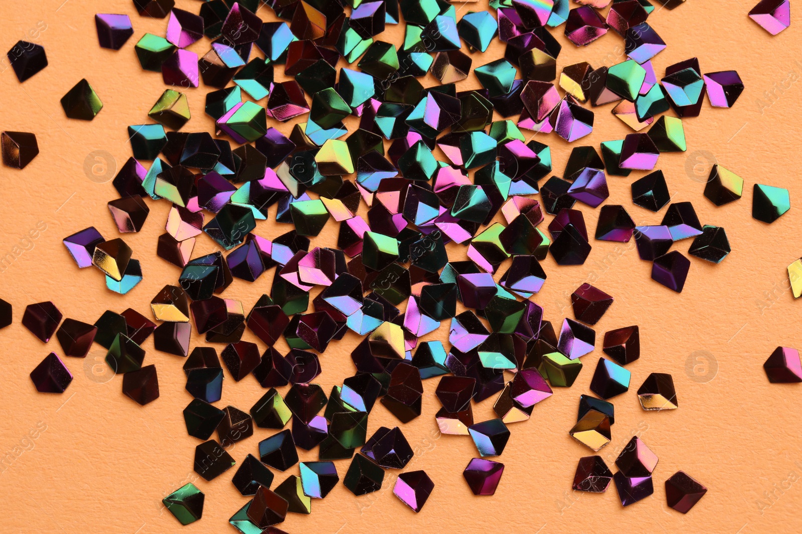 Photo of Pile of shiny glitter on beige background, flat lay