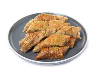 Plate of delicious baklava with pistachios isolated on white