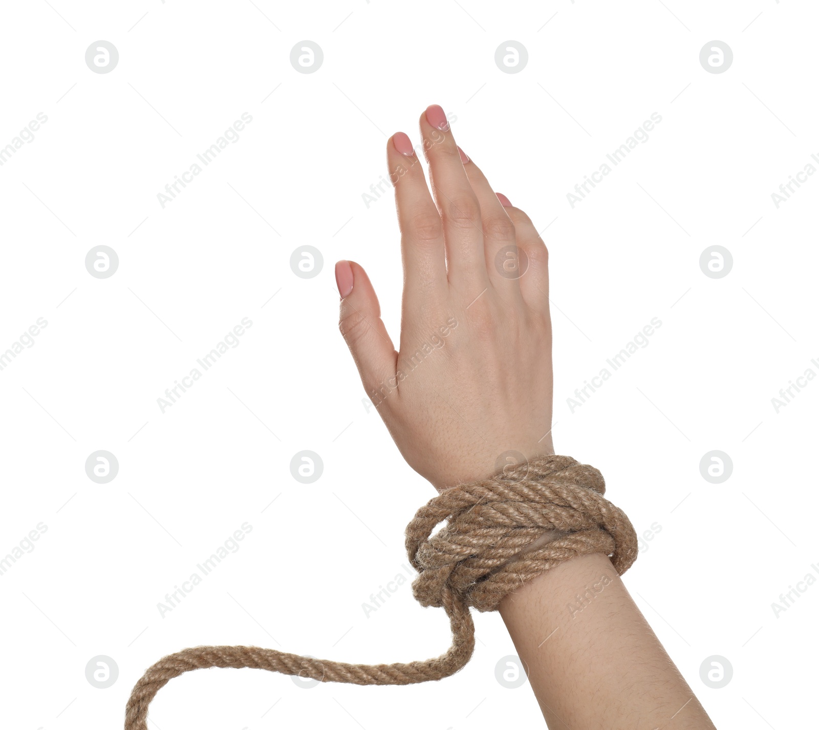 Photo of Freedom concept. Woman with rope on her hand against white background, closeup