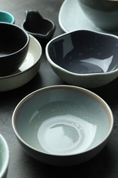 Set of stylish empty bowls on grey table