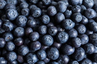 Fresh raw blueberries as background, top view