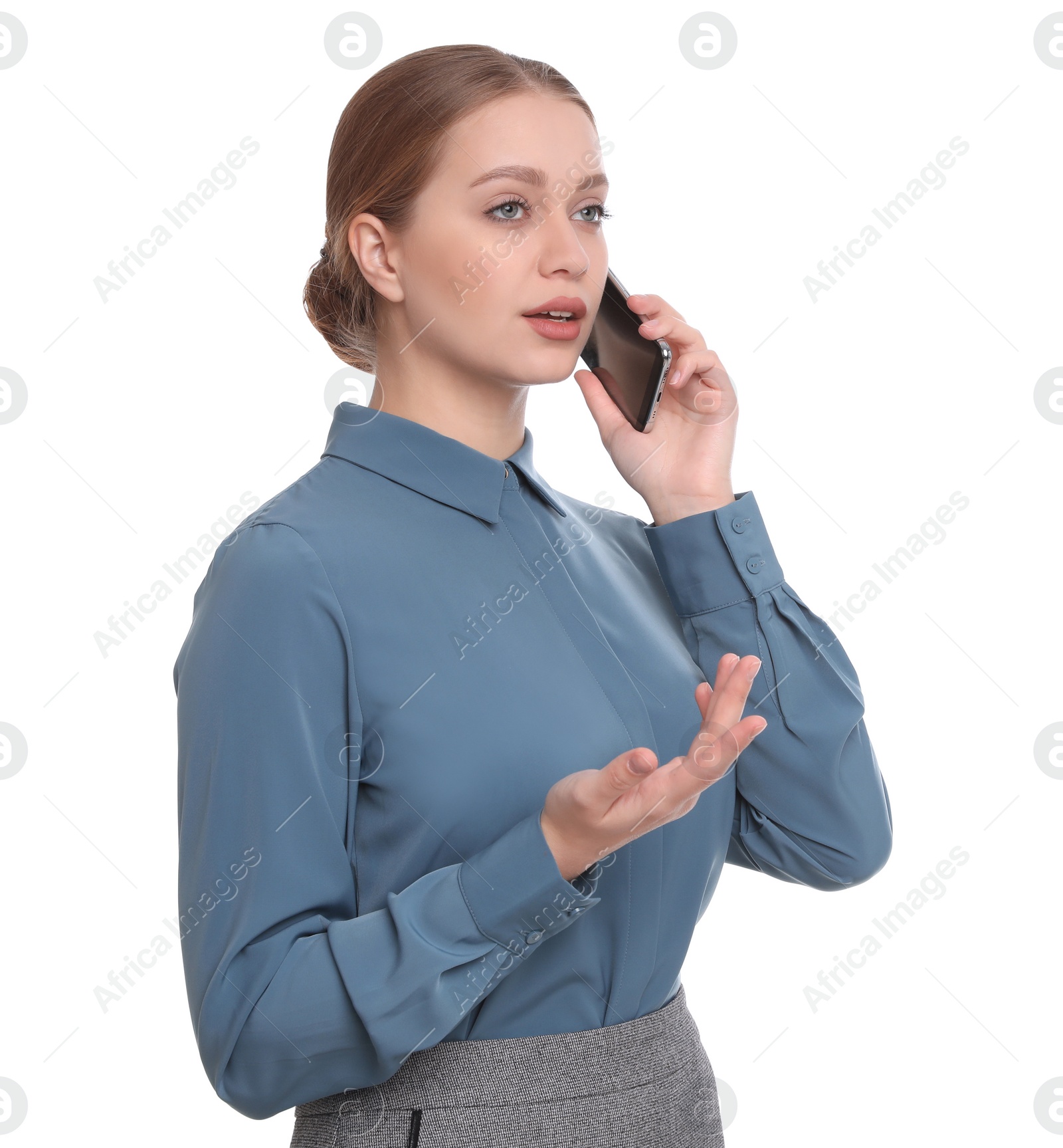 Photo of Young businesswoman talking on mobile phone against white background