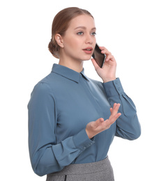 Young businesswoman talking on mobile phone against white background