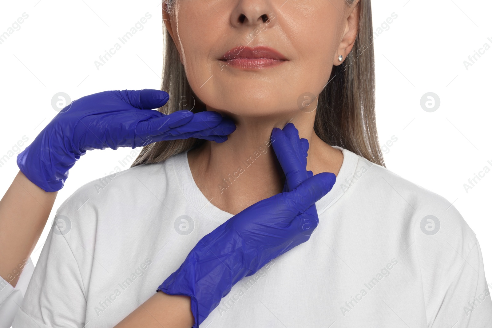 Photo of Endocrinologist examining thyroid gland of patient on white background, closeup