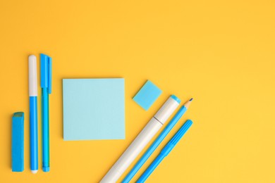 Photo of Flat lay composition with different school stationery on yellow background, space for text. Back to school