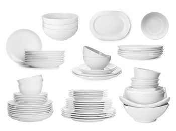 Set with different clean dishware on white background