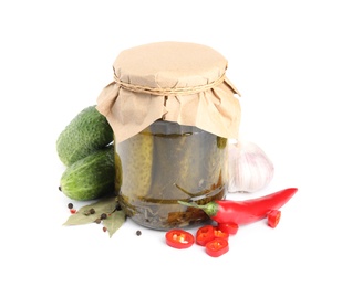 Jar with pickled cucumbers on white background