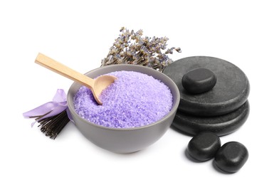 Photo of Violet sea salt in bowl, spa stones, spoon and lavender flowers isolated on white