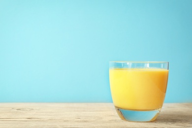 Photo of Glass with delicious detox smoothie on table