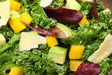 Photo of Delicious fresh kale salad as background, closeup