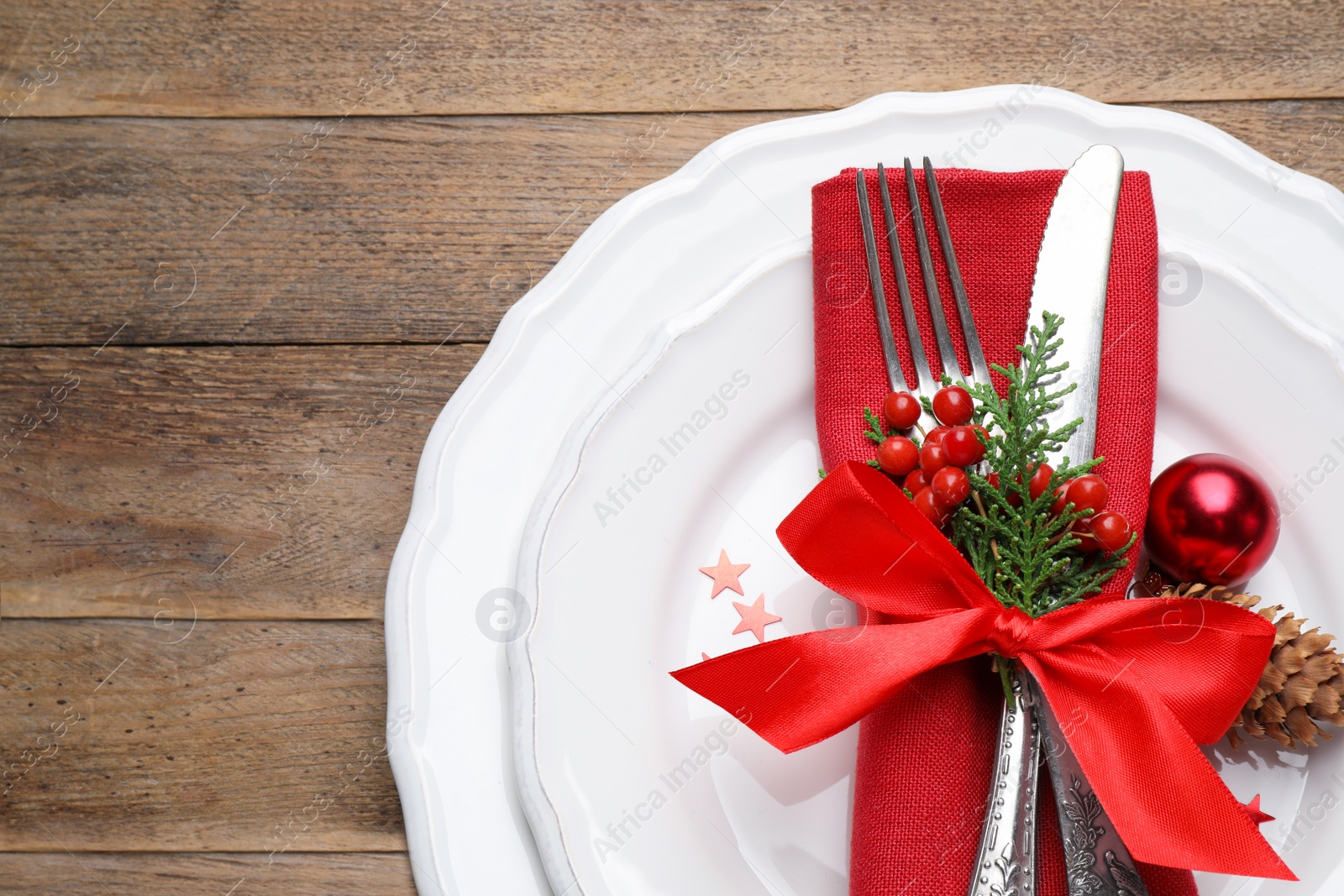 Photo of Beautiful Christmas table setting on wooden background, top view