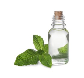 Photo of Bottle of essential oil and mint on white background