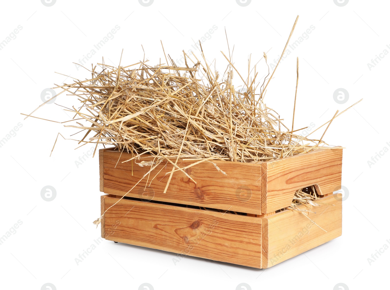 Photo of Dried straw in wooden crate isolated on white