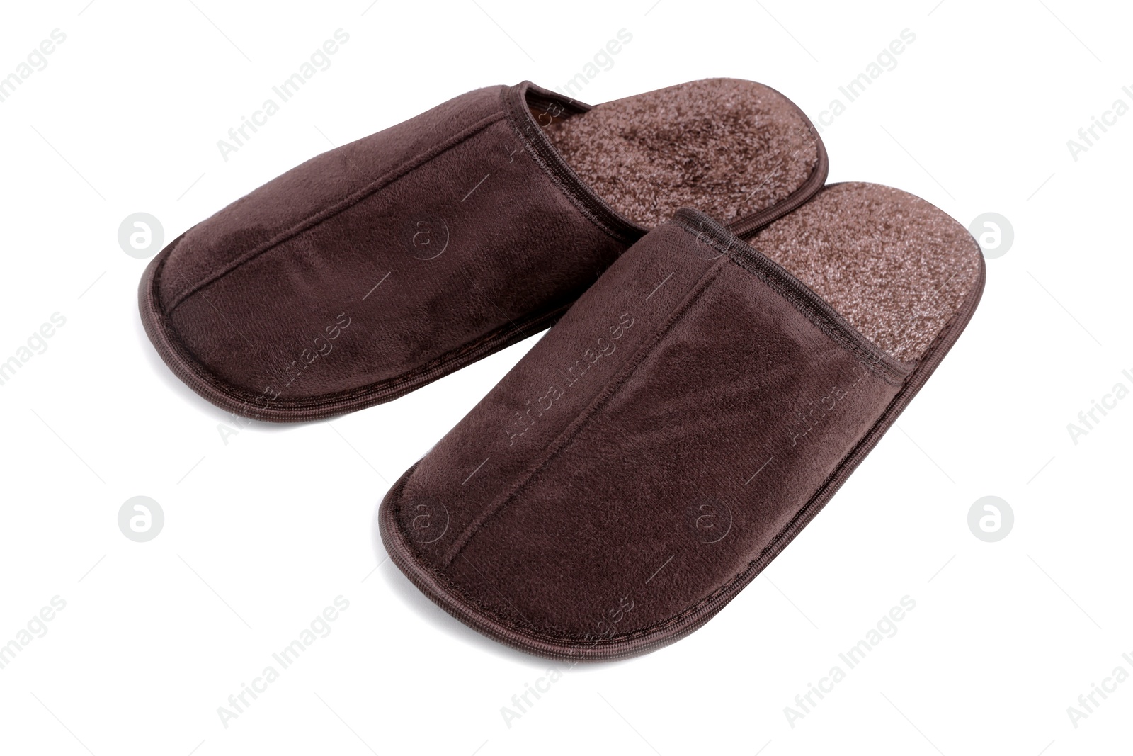 Photo of Pair of soft brown slippers isolated on white