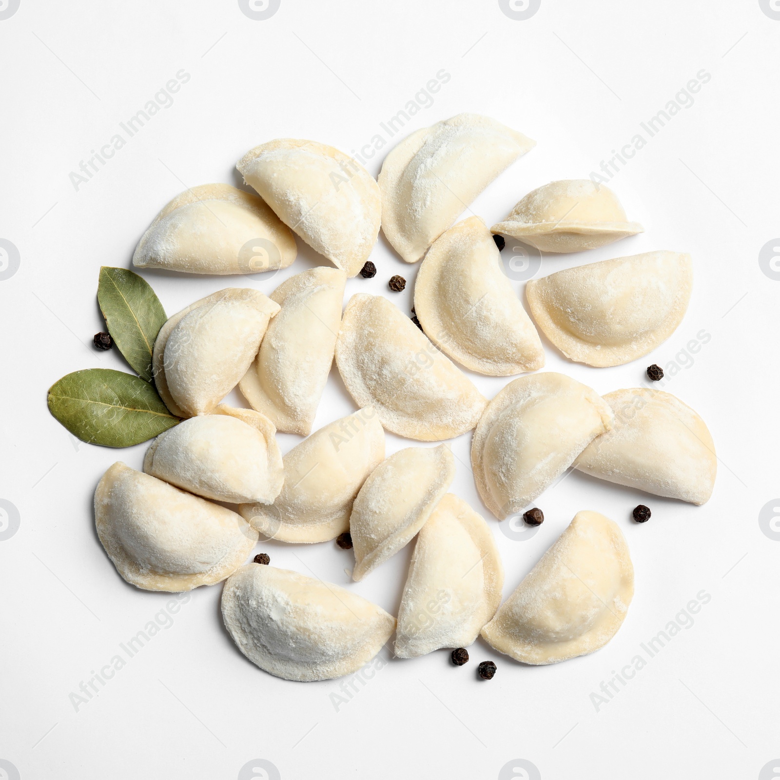 Photo of Raw dumplings on white background, top view. Home cooking