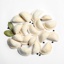 Photo of Raw dumplings on white background, top view. Home cooking