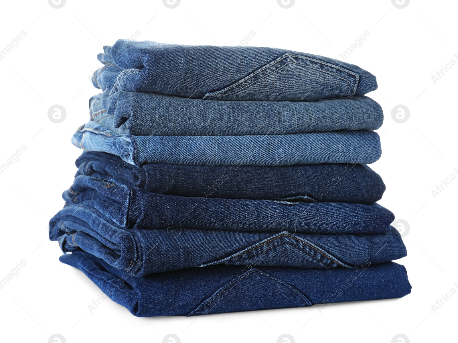 Photo of Stack of different jeans isolated on white