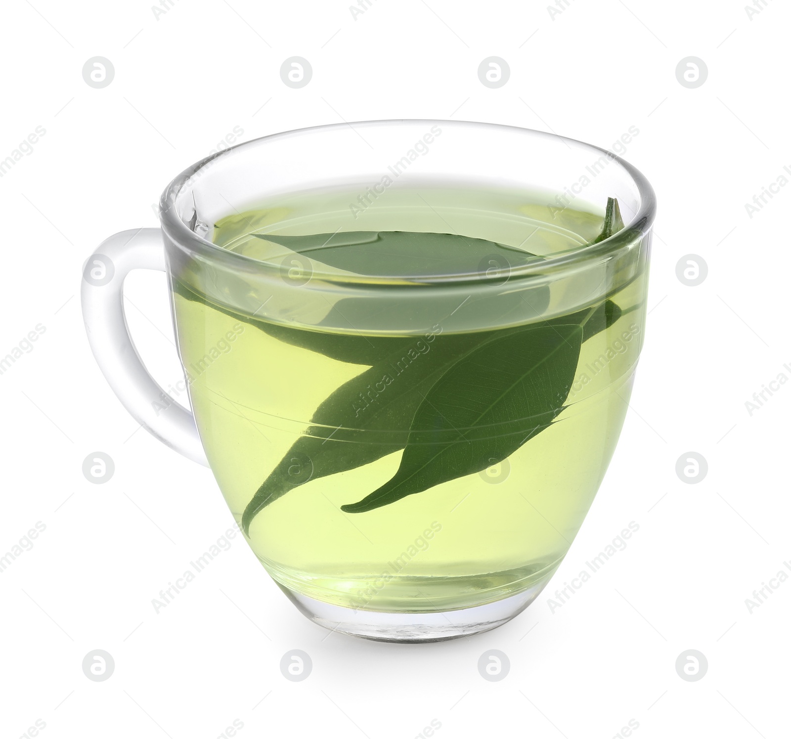 Photo of Fresh green tea in glass cup and leaves isolated on white