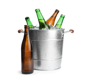 Metal bucket with bottles of beer and ice cubes isolated on white