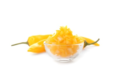 Photo of Bowl with cut ripe hot chili pepper on white background