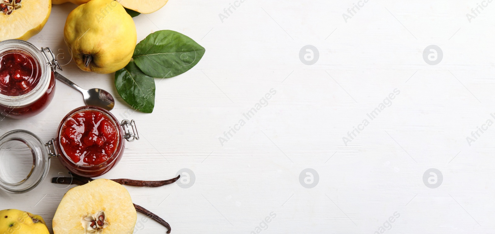 Image of Delicious quince jam and fruits on white wooden table, flat lay with space for text. Banner design