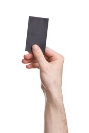 Photo of Man holding blank business card on white background, closeup