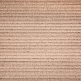 Image of Wall paper design. Brown corrugated sheet of cardboard as background