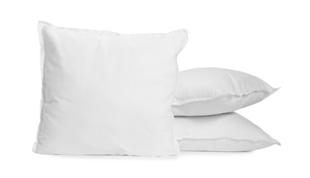Photo of Three new soft pillows isolated on white