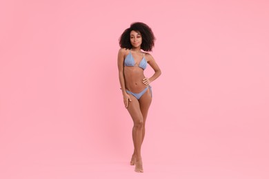 Photo of Beautiful woman in stylish bikini on pink background