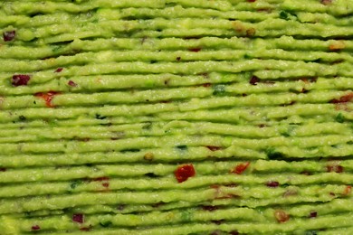 Photo of Delicious fresh guacamole as background, top view