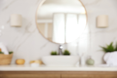 Photo of Blurred view of stylish modern bathroom with mirror