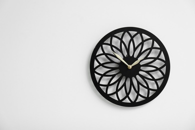 Photo of Stylish clock on white background. Time concept